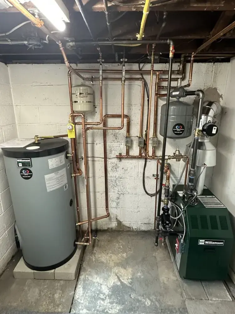 Water heater and mechanical-room piping system configured for a Schertz, Texas service-area property